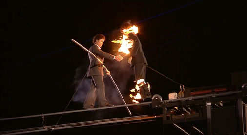2012 Olympics Closing Ceremony London, Wish you were Here handshake man on fire
