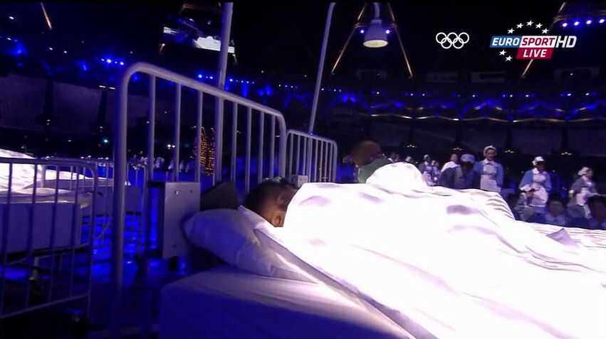 2012 Olympics opening ceremony child sleeping on bed